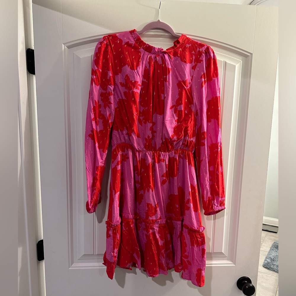 Brand new with tags. Size medium. Beautiful red and pink dress with gold specs!